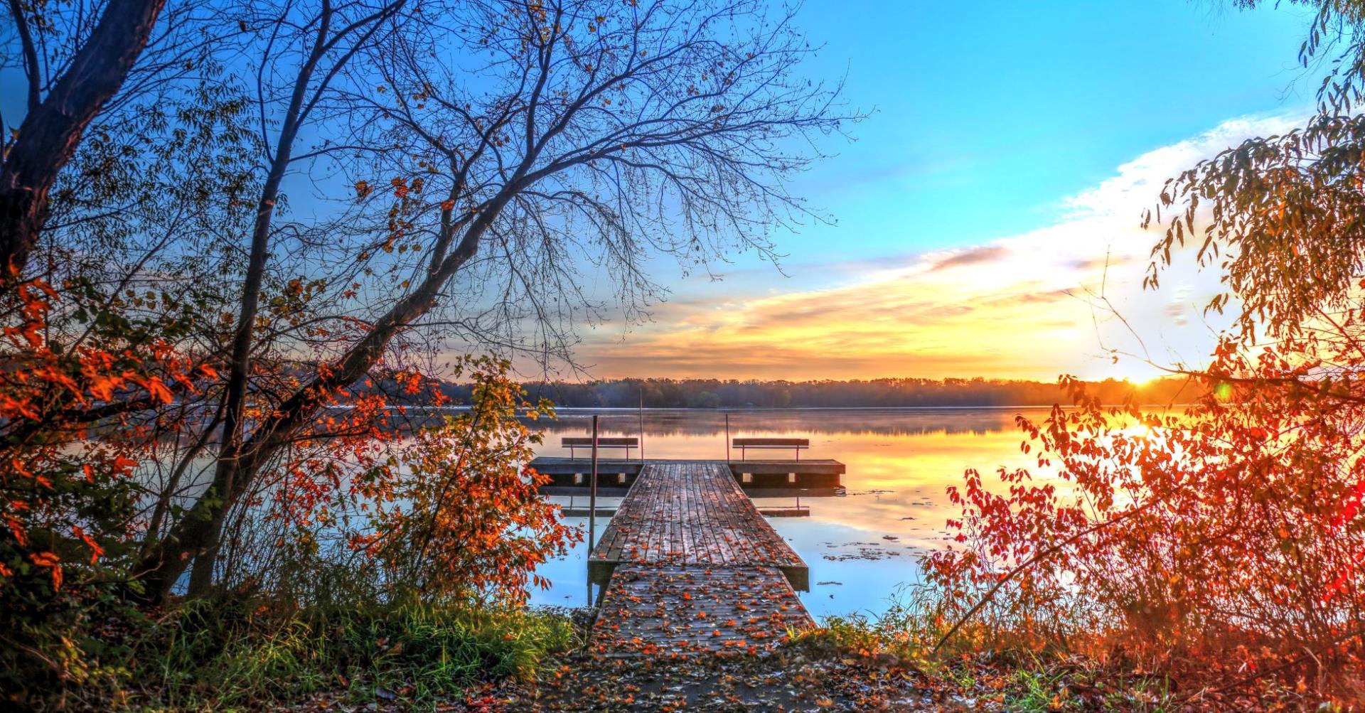 Bright fall leaves frame dock in Staring Lake