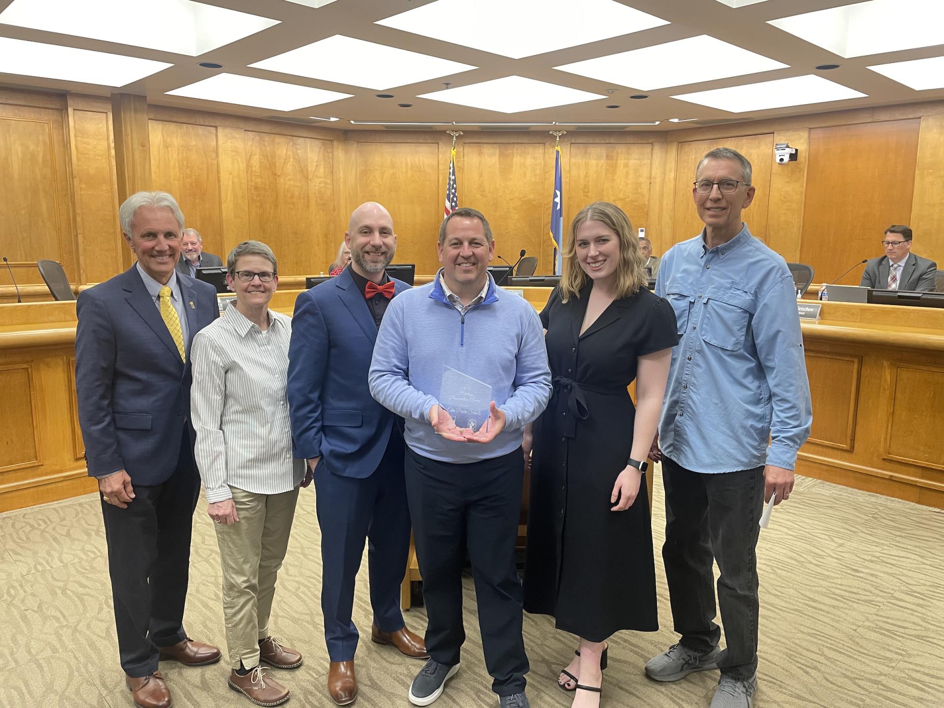 Representatives from EPS are presented with the award