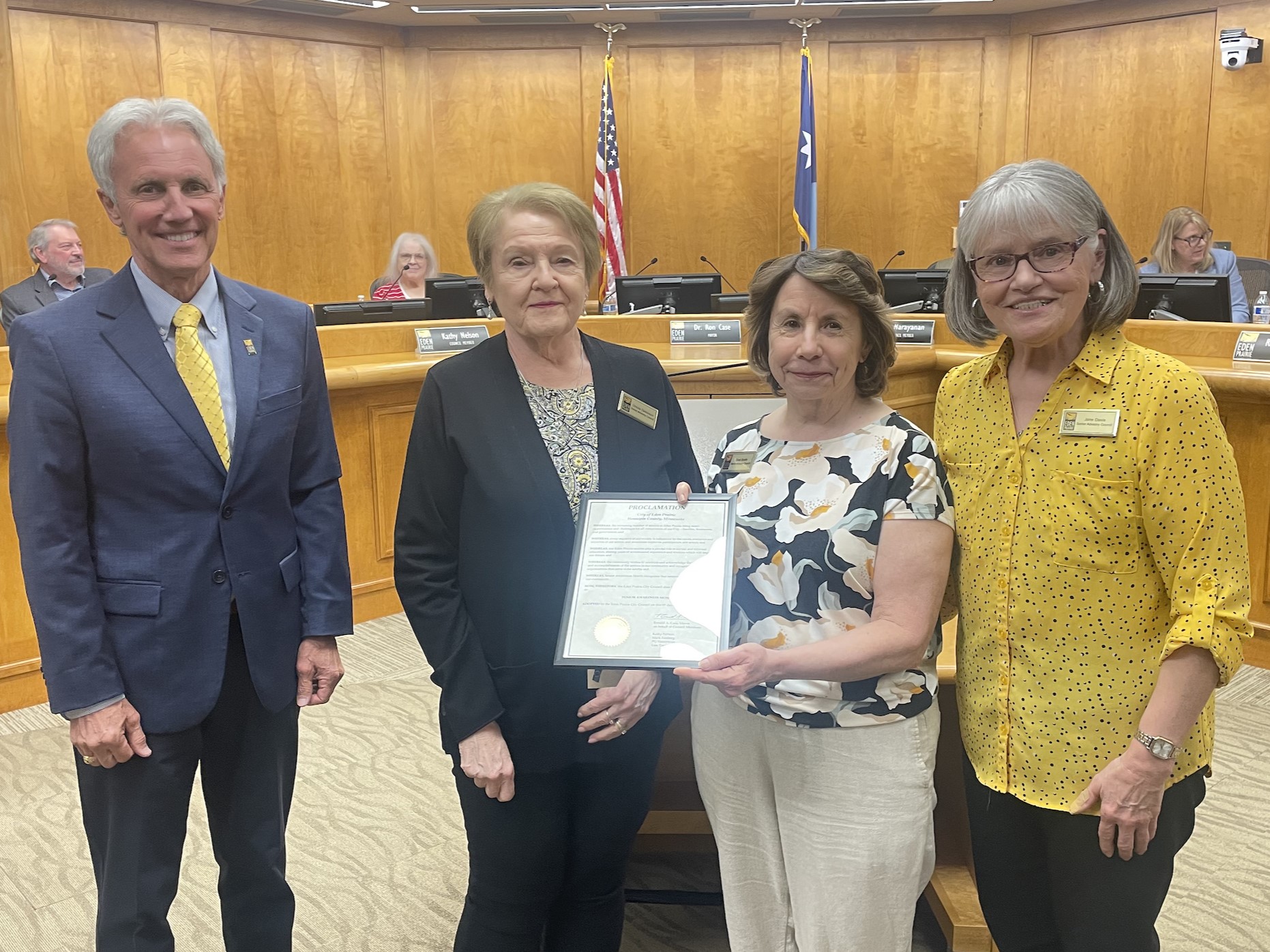 Mayor Ron Case and three Senior Advisory Council members holding Senior Awareness Month Proclamation