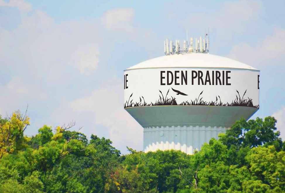 Hidden Ponds Water Tower repainted with Eden Prairie graphics of grass and birds.