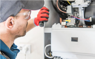 Man with safety goggles inspecting home equipment